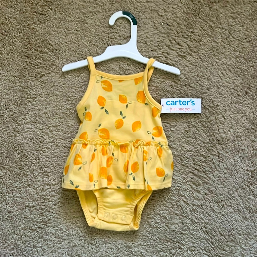 Summertime onsie ! Never wornee worn 3 months Carter With tags!